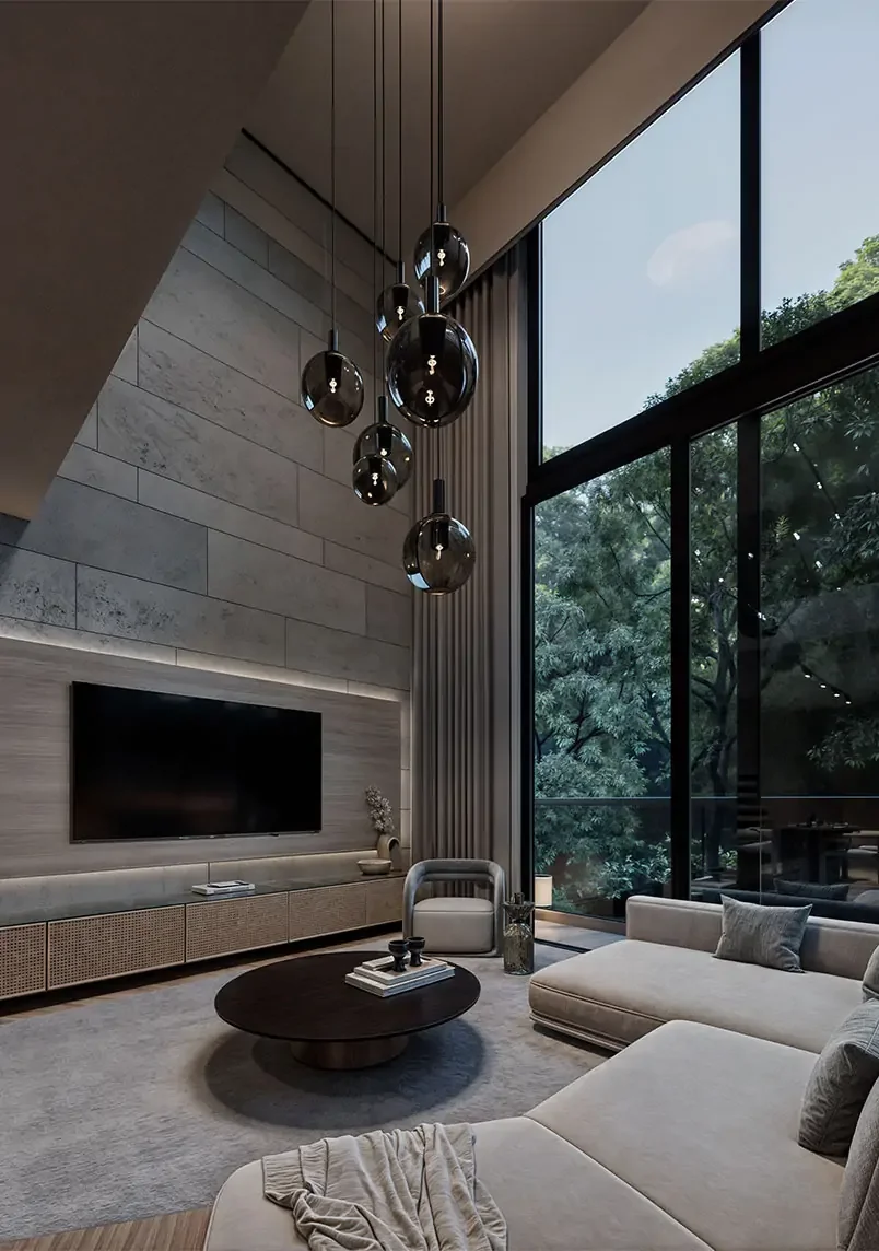 Double-height living room at Aura Peponi with tall windows, pendant lights and a grey sectional sofa.