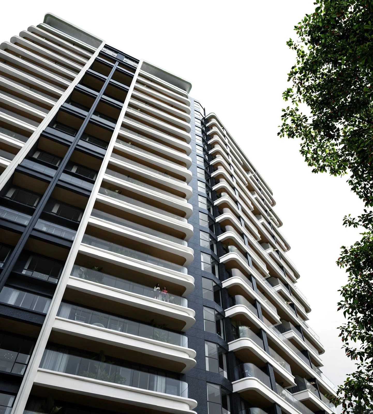 Low-angle exterior rendering of Balkis Residences, Riverside Drive, showing curved white balconies with glass railings.