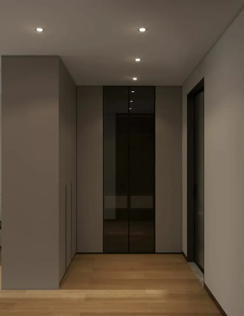 Fitted cabinetry with reflective panels, wood-look flooring and recessed ceiling lights at Baraka Capital Residency, Kilimani.