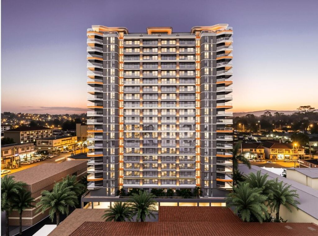 Exterior rendering of Baraka Capital Residency in Kilimani at dusk, showing curved balconies and illuminated windows.