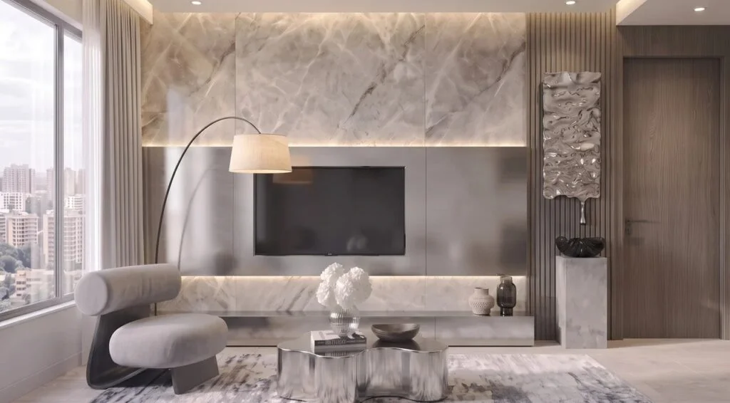 Belmont Residence living area in Kilimani with a wall-mounted television, grey chair and arched floor lamp.