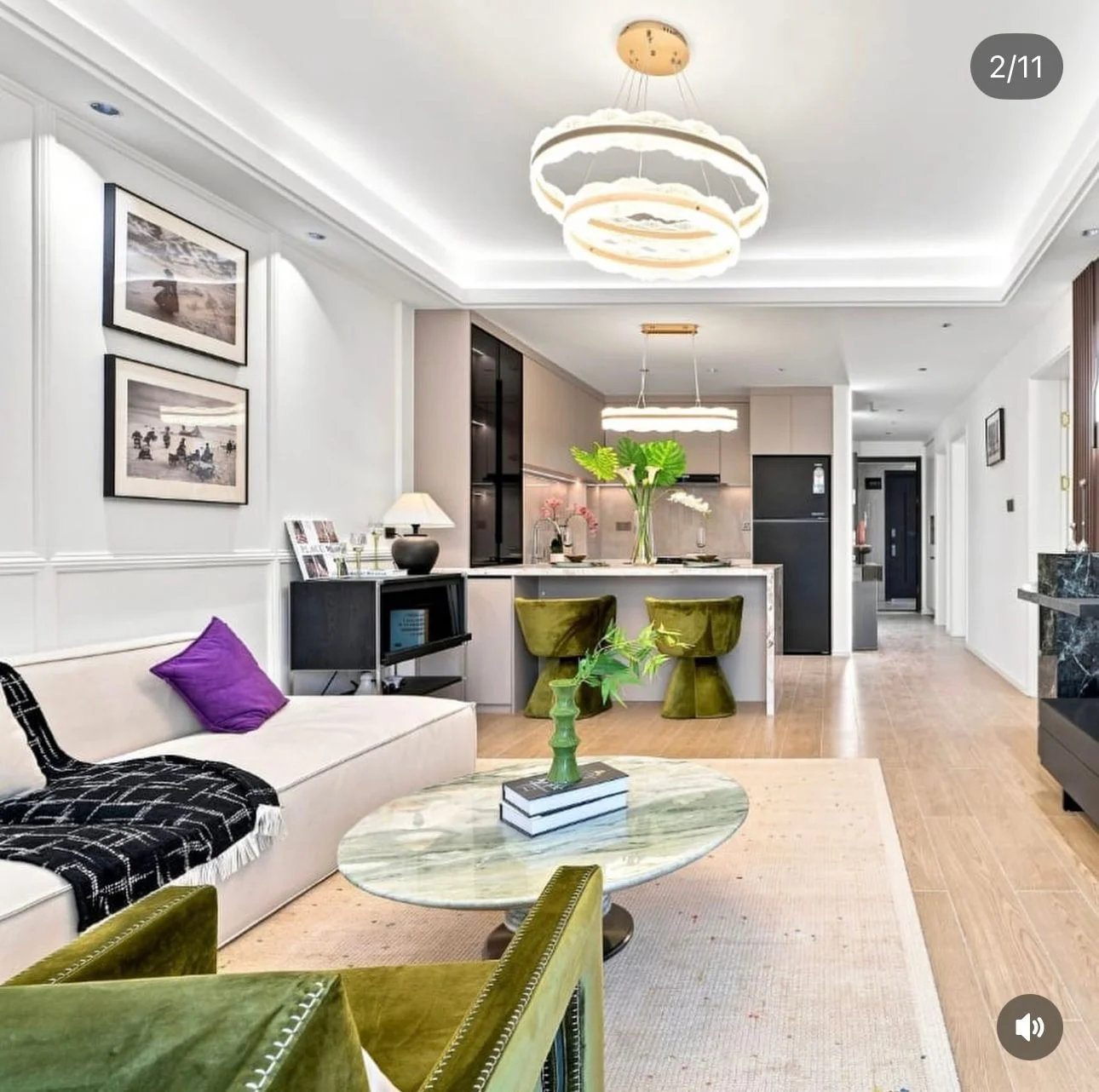 Open-plan living room and kitchen at Capital Heights, Westlands, with a cream sofa and green seating.