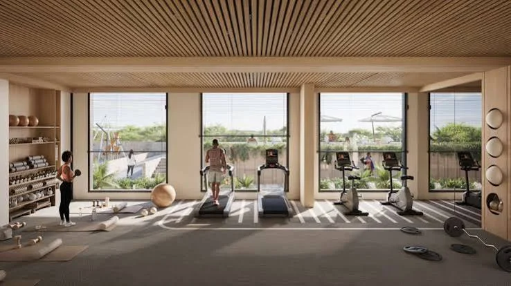 Gym rendering at Enzo Residences, Riverside, with treadmills, exercise bikes and large windows.