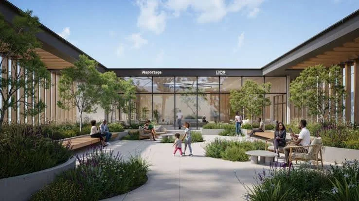 Landscaped courtyard rendering at Enzo Residences, Riverside, with trees, benches and people on paved walkways.