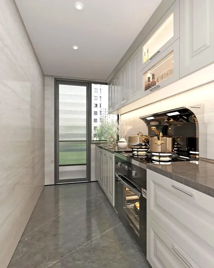Narrow kitchen at Lido Garden, Kilimani, with pale cabinetry, a gas hob and built-in oven.