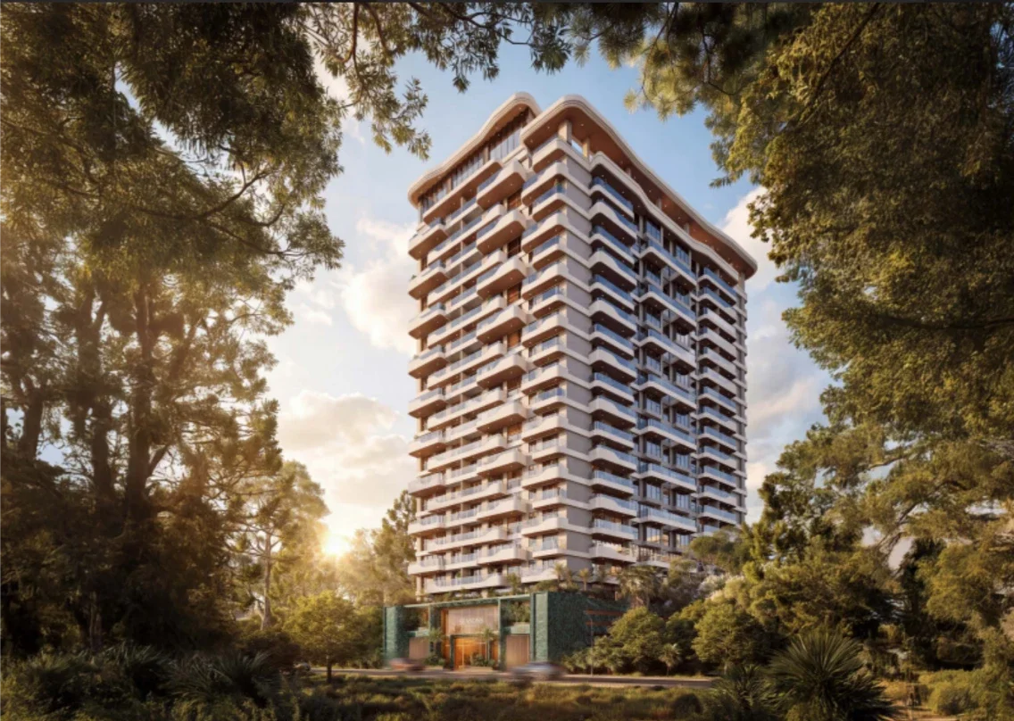 Rendered apartment tower on Riverside Drive, Nairobi, with curved balconies and surrounding trees.