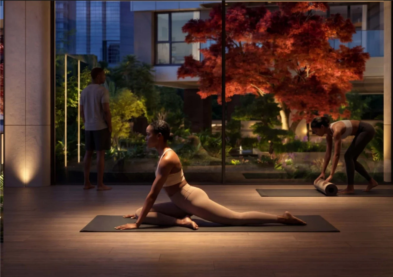 Yoga area rendering at Riverside Drive duplex development, with a woman stretching beside garden-facing windows.