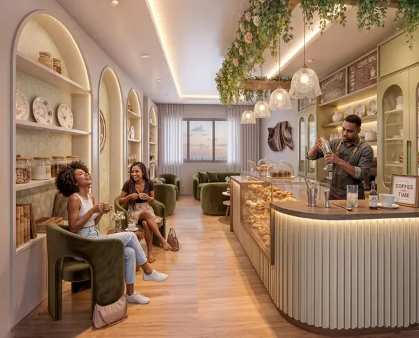 Café rendering for Riverside Times Apartments with green armchairs, a pastry display and pendant lights.