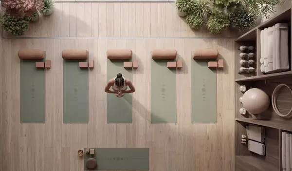 Overhead rendering of the yoga area at Riverside Times Apartments, with green mats and a person exercising.