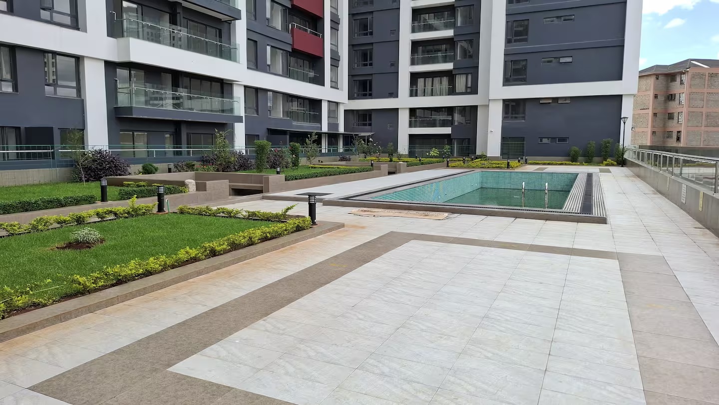 Swimming pool, landscaped gardens and tiled courtyard at South Park Apartments in South C.
