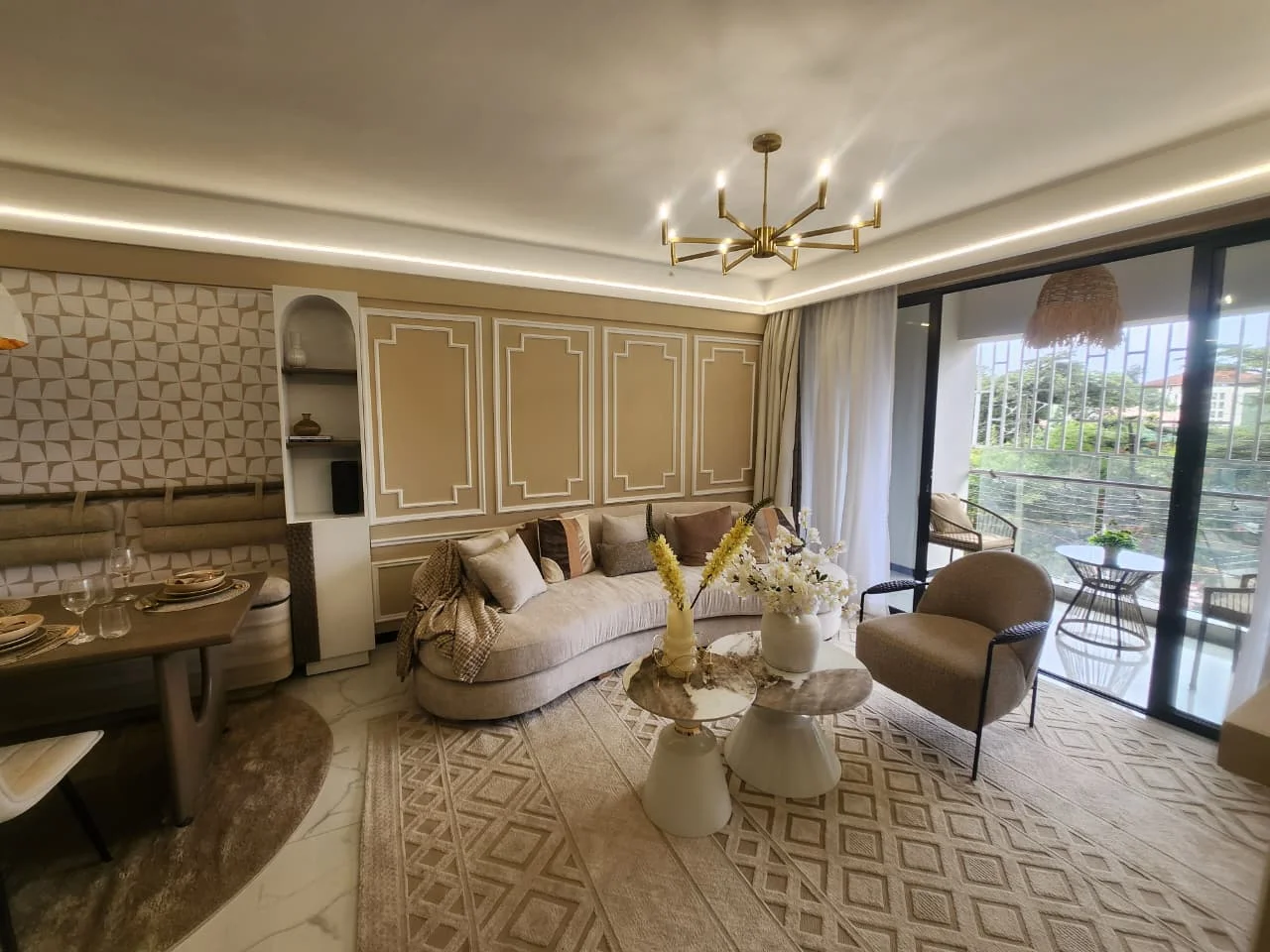 Furnished living and dining area at Super Westbury, Westlands, with a curved sofa and sliding balcony doors.